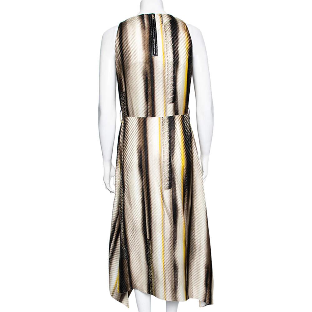 Coming from the House of Salvatore Ferragamo, this beautiful dress will add a chic edge to your style! Tailored from multicolored snake-print patterned satin fabric, this dress flaunts an asymmetric detail and a sleeveless style. It is provided with