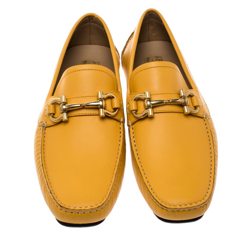 These mustard loafers from Salvatore Ferragamo are not only high on appeal but also very skilfully made. They have been crafted from quality leather in Italy and designed with beauty using neat stitching and the Gancini logo on the uppers. The