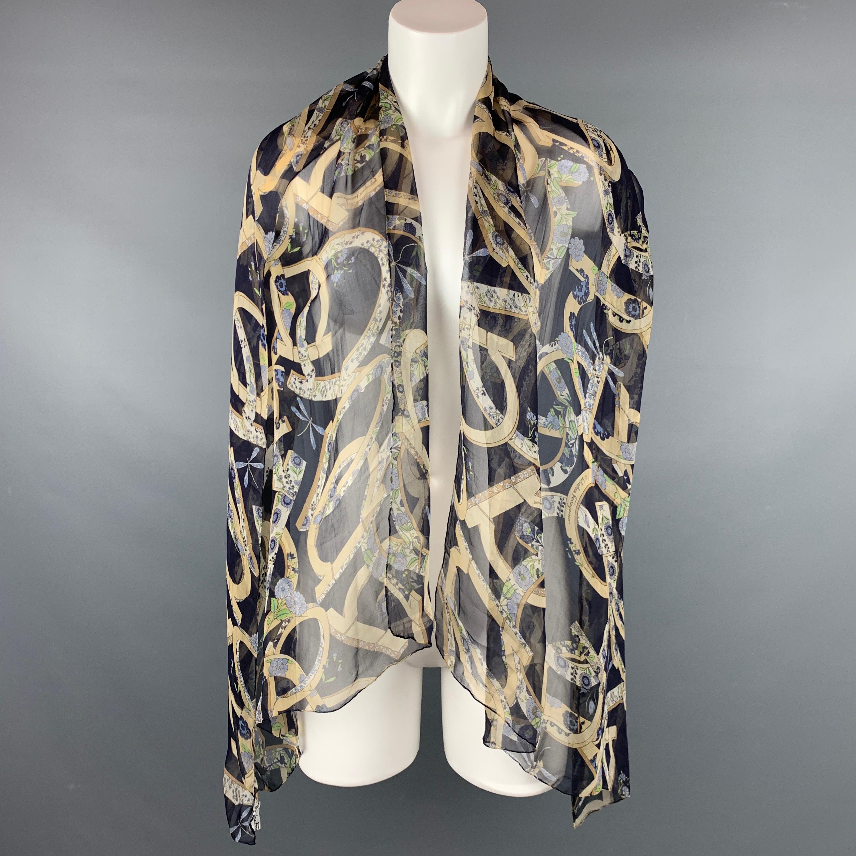 SALVATORE FERRAGAMO scarf comes in a navy & beige floral chiffon silk. Made in Italy.

Very Good Pre-Owned Condition.

Measurements:

27 in. x 70 in. 