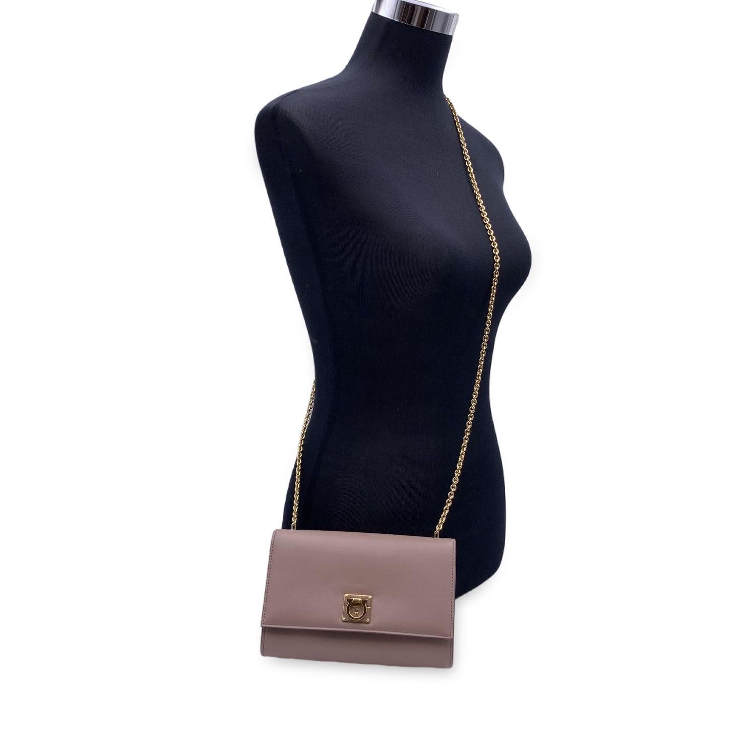 This beautiful Bag will come with a Certificate of Authenticity provided by Entrupy. The certificate will be provided at no further cost. Salvatore Ferragamo leather shoulder bag featuring Gancino lock closure. Gold metal hardware. Removable chain