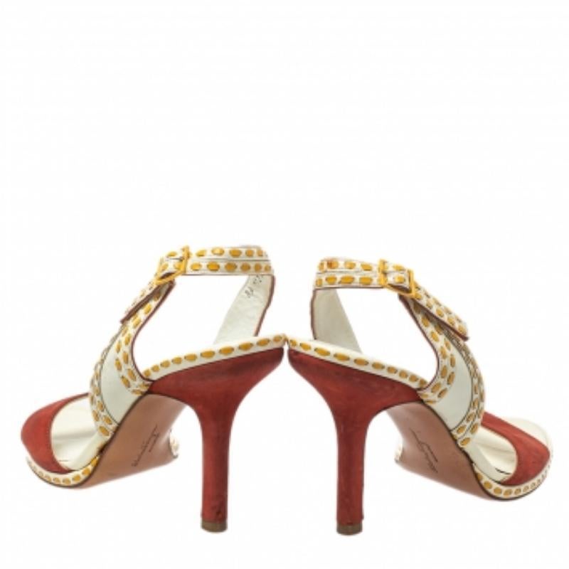 These exquisite slide sandals from Salvatore Ferragamo are a statement in themselves. Crafted with patent leather and leather, the sandals feature neat stitches, slender heels, and slingbacks.