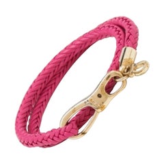 Salvatore Ferragamo Bracciale a fascia in pelle intrecciata rosa tono oro
