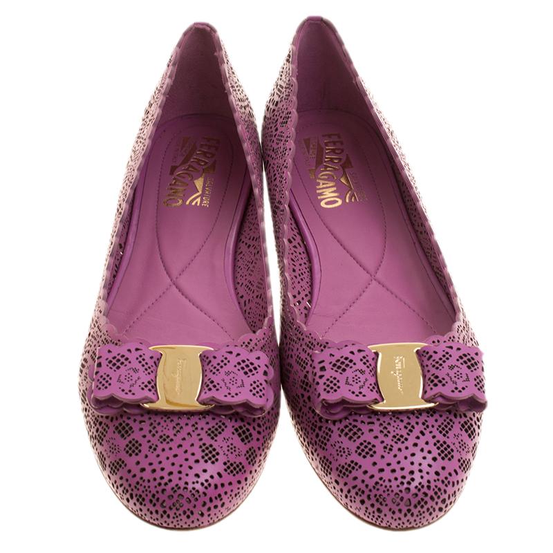 Fashion is the perfect blend of luxury with comfort, and this pair of ballet flats from the house of Ferragamo exudes just that. Crafted from leather and styled with laser cuts, and their signature bow, these pink flats are ideal for shopping and