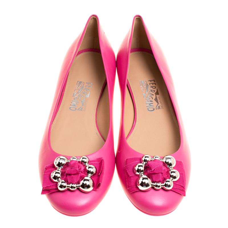 There is beauty in these Ferragamo flats not only by way of design but also in the way they have been made. They are covered in gorgeous pink leather, lined with leather and finished with metal-detailed bows on the uppers.

Includes: Original