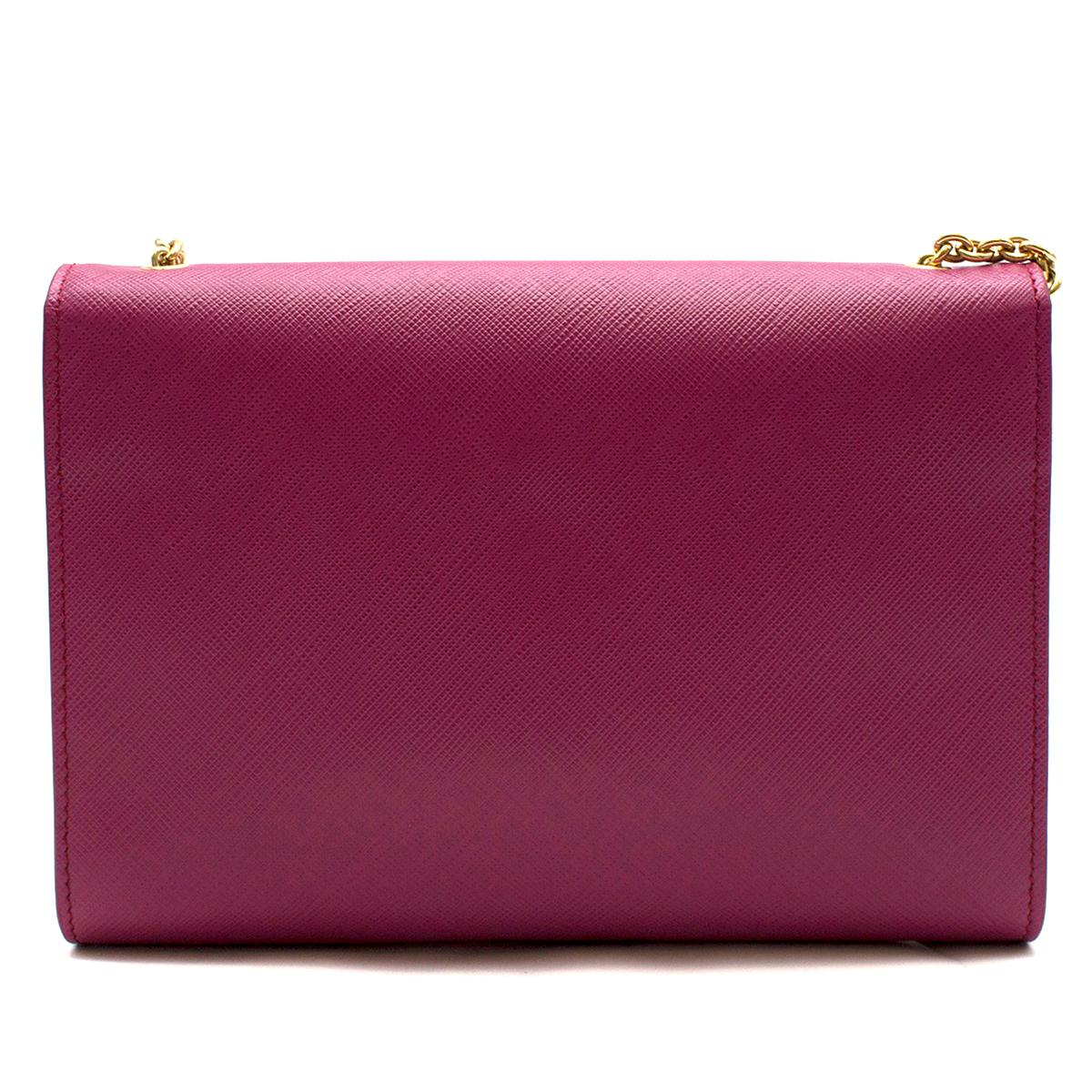 Salvatore Ferragamo Pink Leather Medium Ginny Shoulder Bag

-a front flap closure with the brand's signature grosgrain bow detailing and a chain and leather woven shoulder strap. 
-Opens to a satin lined interior and houses a zipped pocket.

Please