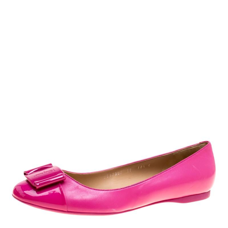 Walk with style and comfort in these Petrina flats from Salvatore Ferragamo. Crafted from leather in Italy, these pink flats carry round toes, leather insoles and signature bows on the shiny cap toes. They are complete with the brand label on the