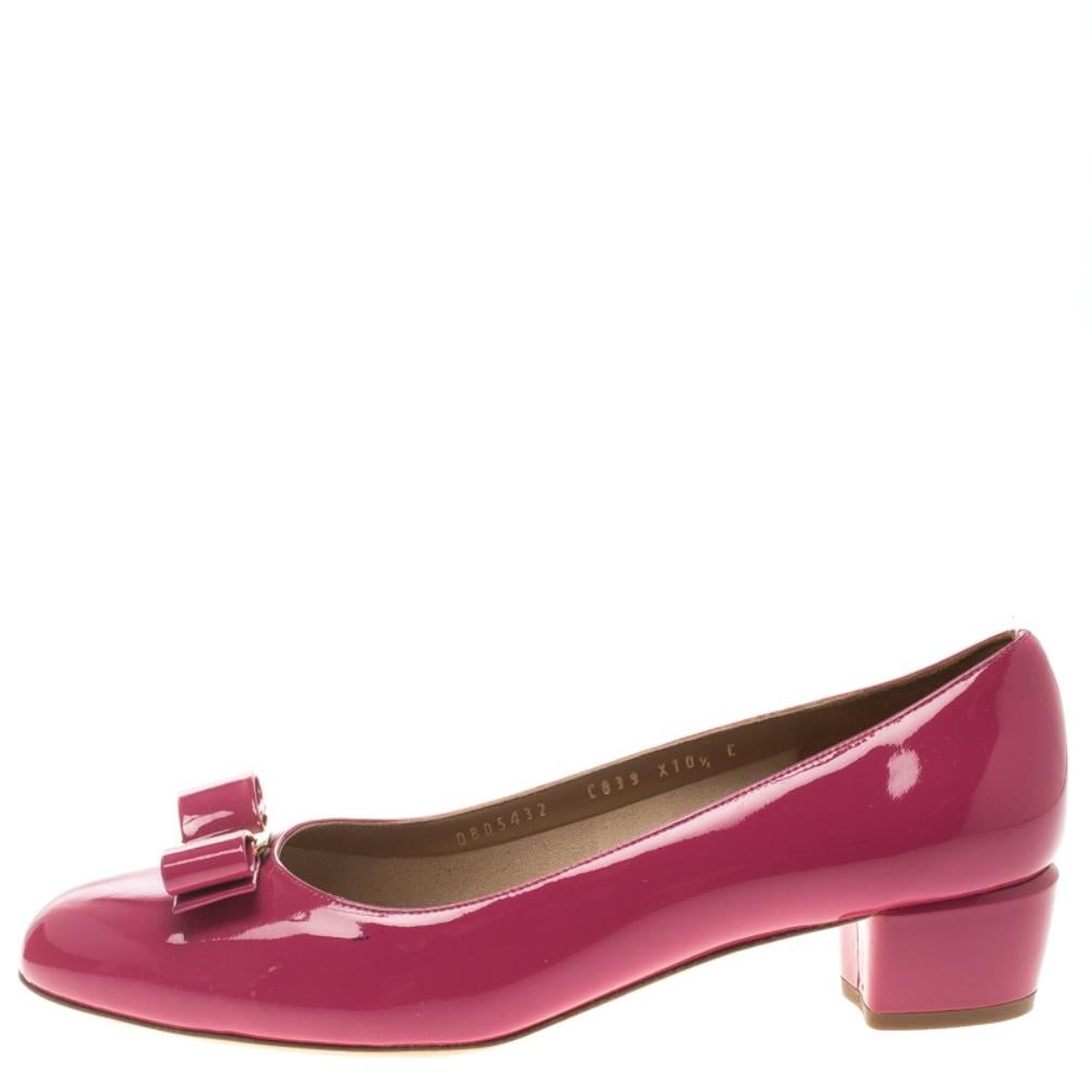 Nothing like an adorable pair of pumps to look and feel like a modern princess! Crafted from patent leather in a dreamy pink hue, this gorgeous Ferragamo pair features leather-lined insoles housing the brand's iconic label. Complete with block heels