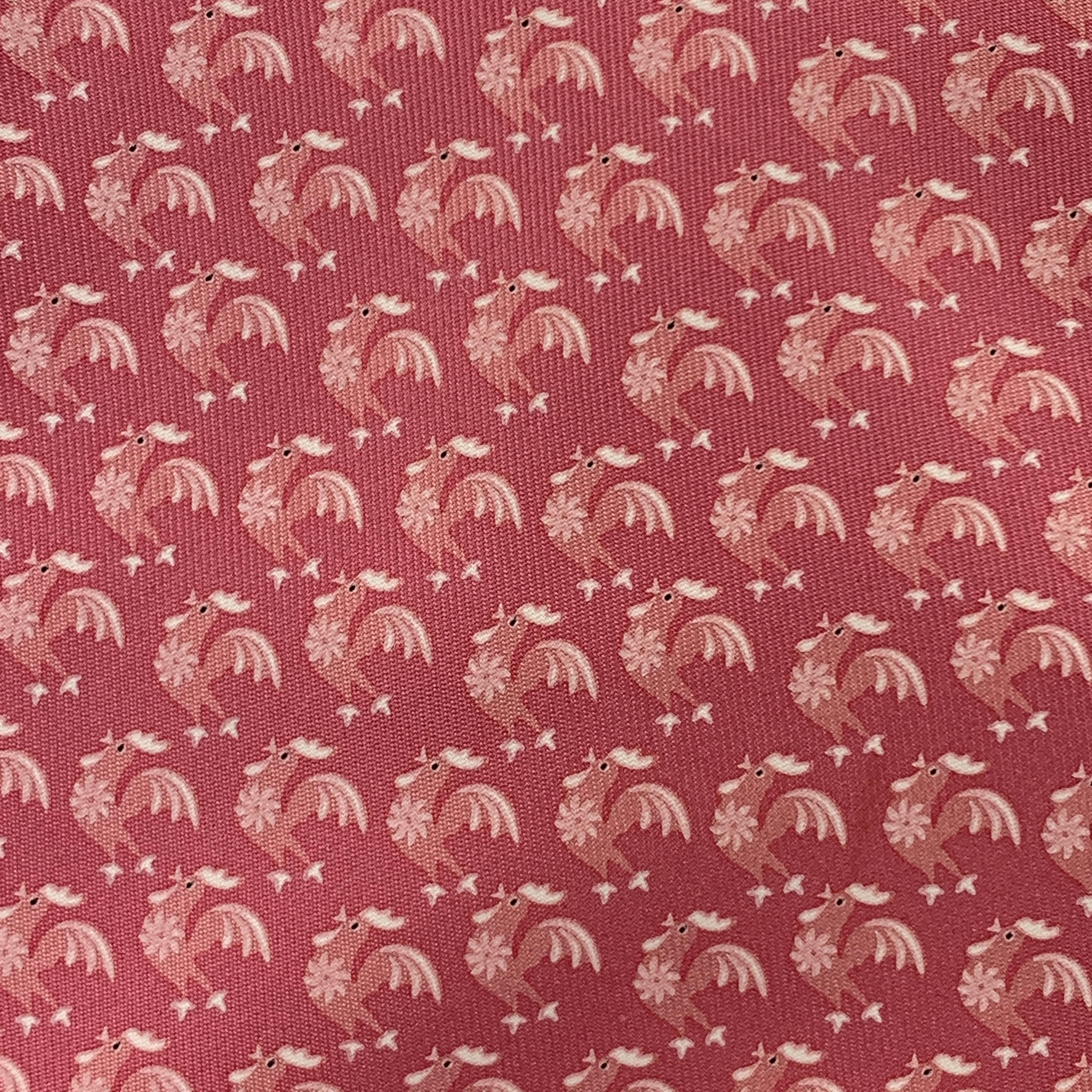 SALVATORE FERRAGAMO necktie comes in pink silk with all over rooster print. Made in Italy.

Excellent Pre-Owned Condition.

Width: 4 in.  