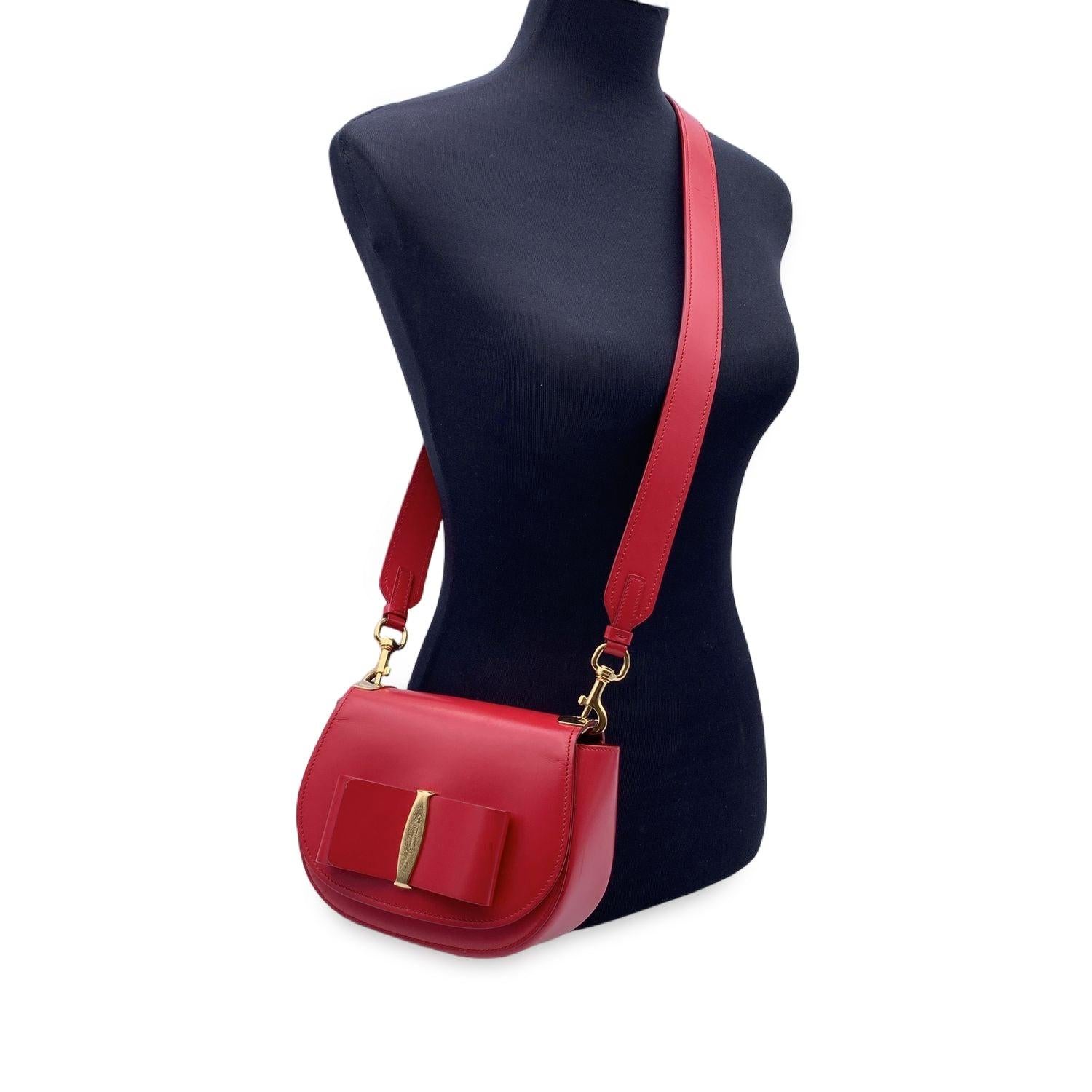 Salvatore Ferragamo red leather 'Anna' shoulder bag. Front Vara bow. Flap with push closure. Leather lining. 1 side open pocket inside. Removable shoulder strap. Salvatore Ferragamo tag inside Condition A - EXCELLENT Gently used. Some light