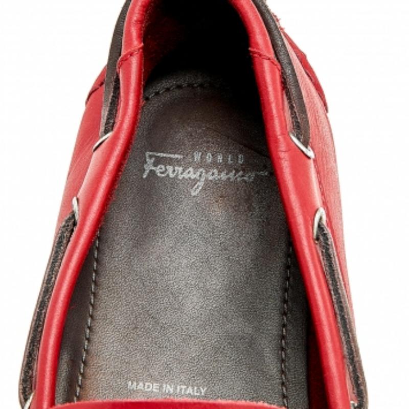 Crafted from leather, these loafers by Salvatore Ferragamo are a must-have in your wardrobe. Red in color, they have the perfect elongated front and are adorned with strap detailing on the vamps. These can be paired with both formal and casual