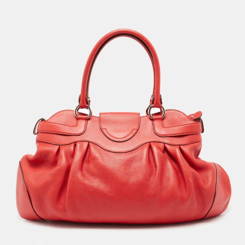 Get ready for your next outing by carrying this spacious red satchel from Salvatore Ferragamo. It is crafted from leather and features dual handles, a top zipper, and silver-tone hardware.

Includes: Original Dustbag
