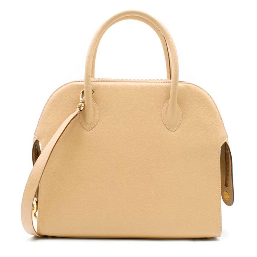 Salvatore Ferragamo Sand Leather Shoulder Bag

- Sand grained leather
- Double rolled top handles
- Detachable shoulder strap
- Zip top closure with logo chain zip pulls
- Gold-tone hardware
- Two main internal compartments with an additional flat