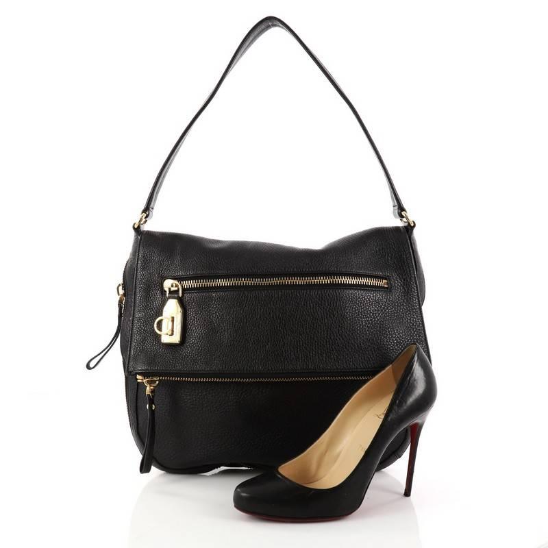 This authentic Salvatore Ferragamo Selma Shoulder Bag Leather Medium is a stylish bag to carry all day long. Crafted in black leather, this bag features a flat leather shoulder strap, zip around bottom to reveal a contrasting hue for an updated