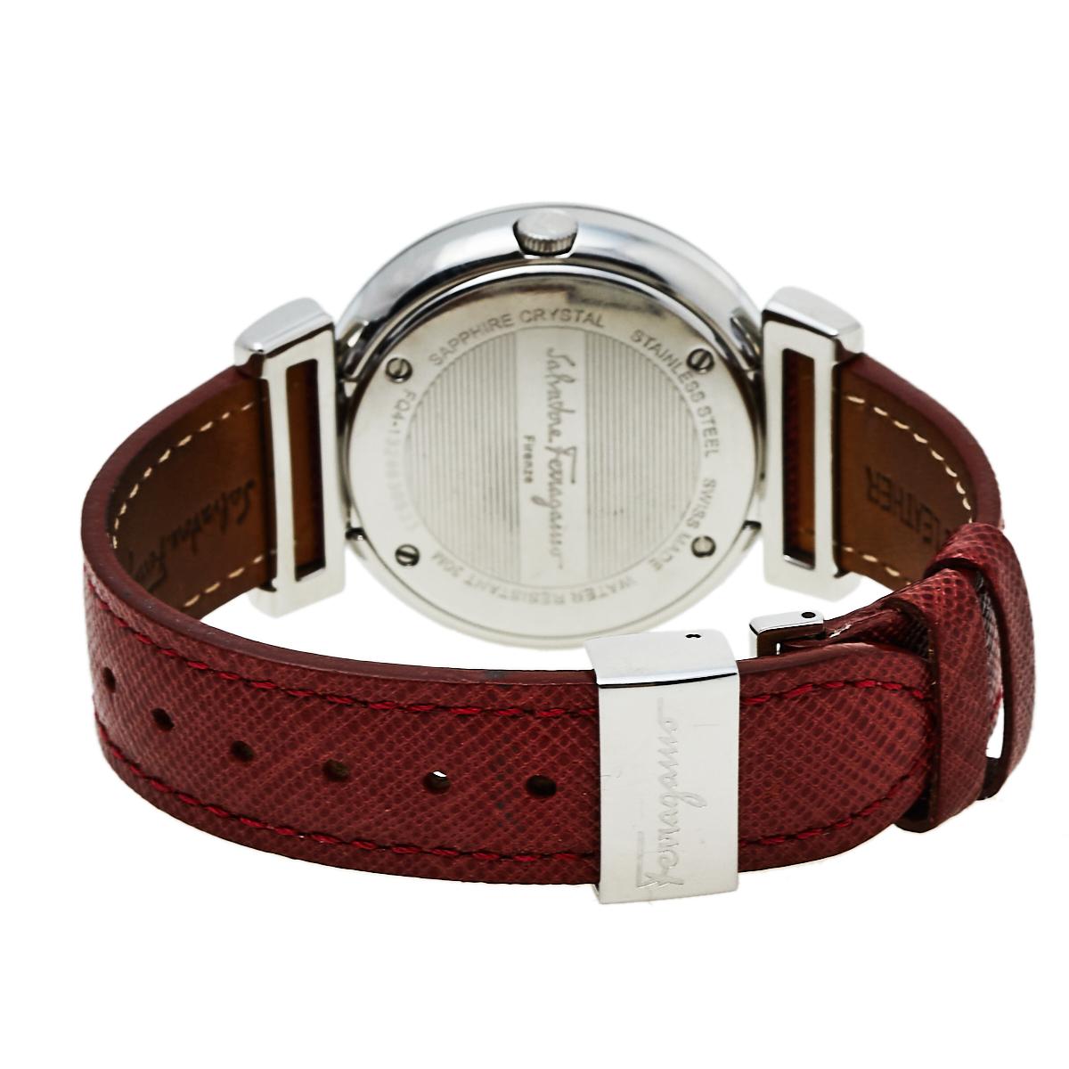 Elegant design and subtle aesthetics define this Quartz watch from the house of Salvatore Ferragamo. It is rendered beautifully in a stainless steel case and held by red leather straps. The efficient accessory has been assembled with precision and