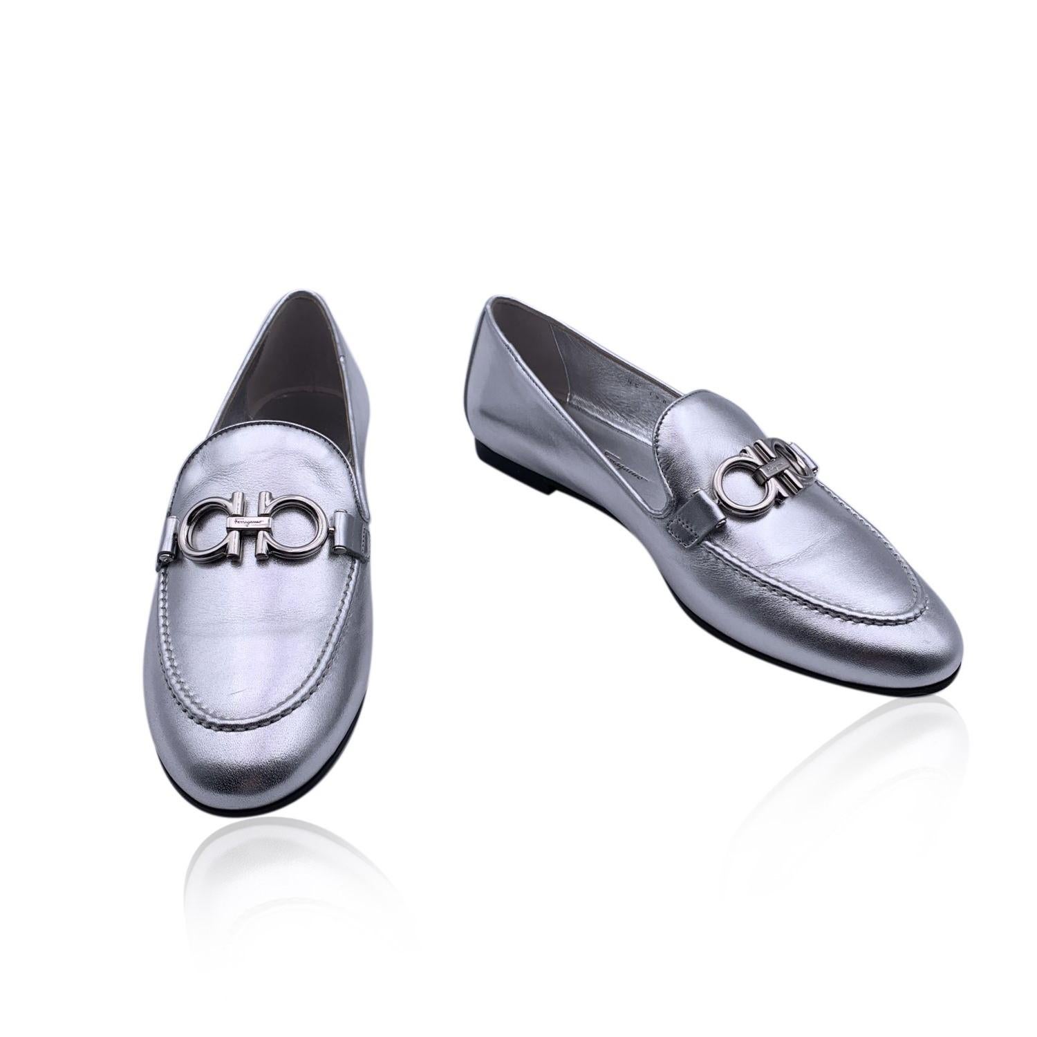 Beautiful Salvatore Ferragamo 'Trifoglio' Moccassins Loafers Shoes. Crafted in silver-tone leather. They feature an almond toe, silver metal Gancini detailing on the toes and slip-on design. Rubber sole. Heels height: 1cm. Made in Italy. Size: US