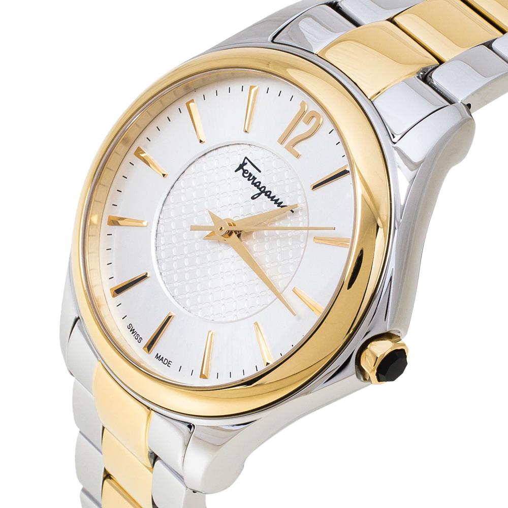 Subtle elegance is the highlight of this lovely watch from Salvatore Ferragamo which is brimming with fine details and chic style. This timepiece has a round stainless steel case which is held by a two-toned stainless steel bracelet, secured by a
