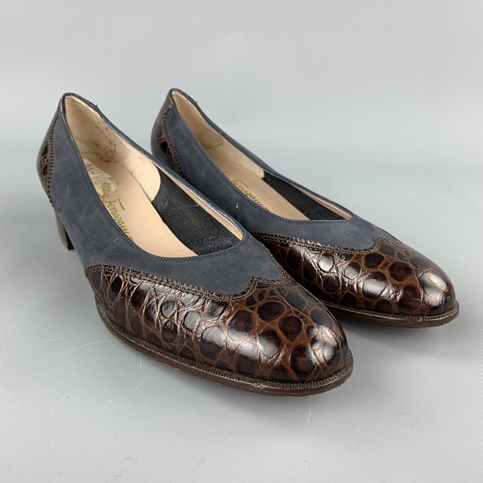 SALVATORE FERRAGAMO pumps comes in a blue suede with a brown embossed detail featuring a wooden heel. Made in Italy.Very Good
Pre-Owned Condition. 

Marked:   10 

Measurements: 
  Heel: 1.5 inches 
Length: 10.5 inches 
  
  
 
Reference: