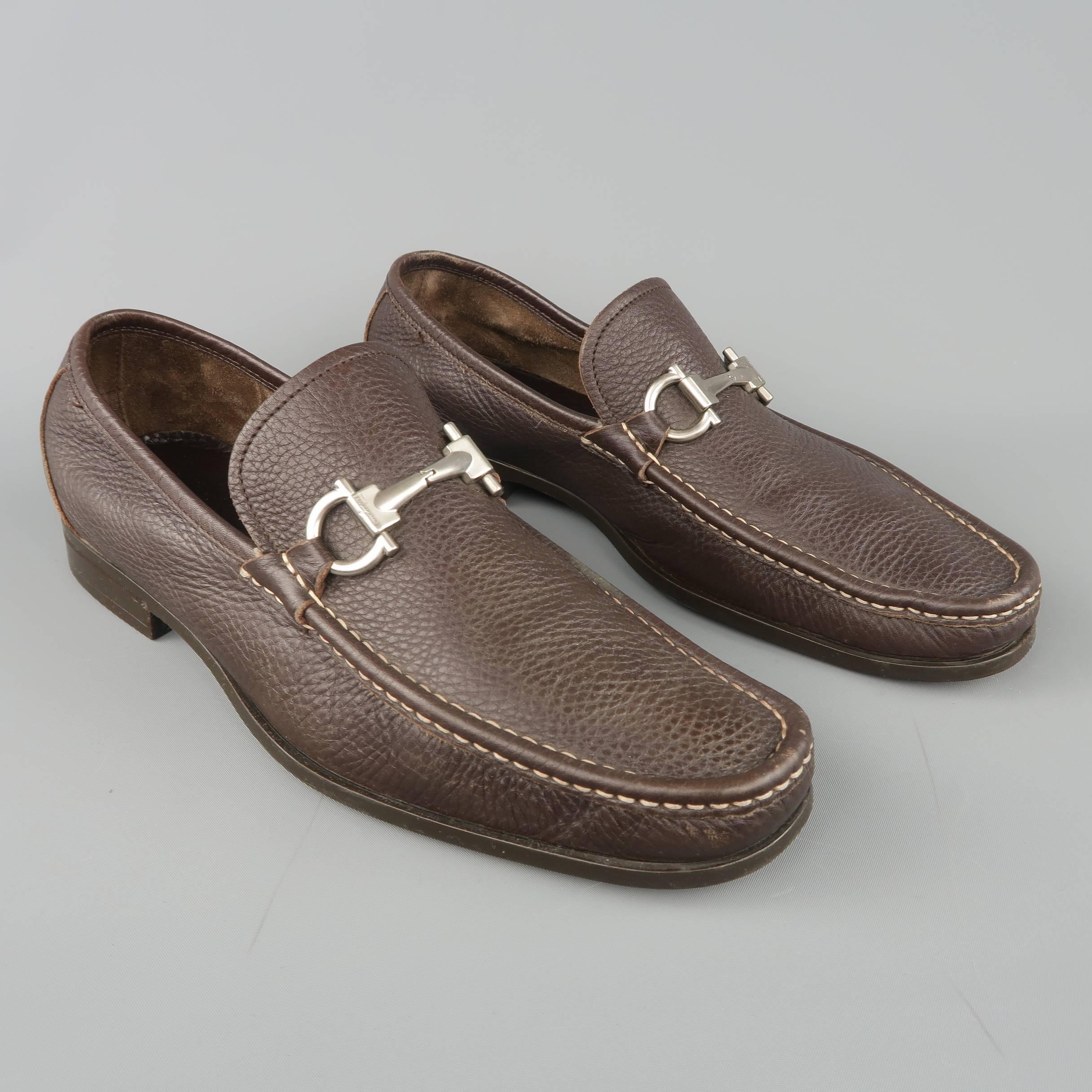 SALVATORE FERRAGAMO dress loafers come in textured brown leather with an apron toe, contrast stitching, and silver tone metal horsebit. Made in Italy.
 
Excellent Pre-Owned Condition.
Marked: UK 10
 
Outsole: 11.65 x 4 in.
