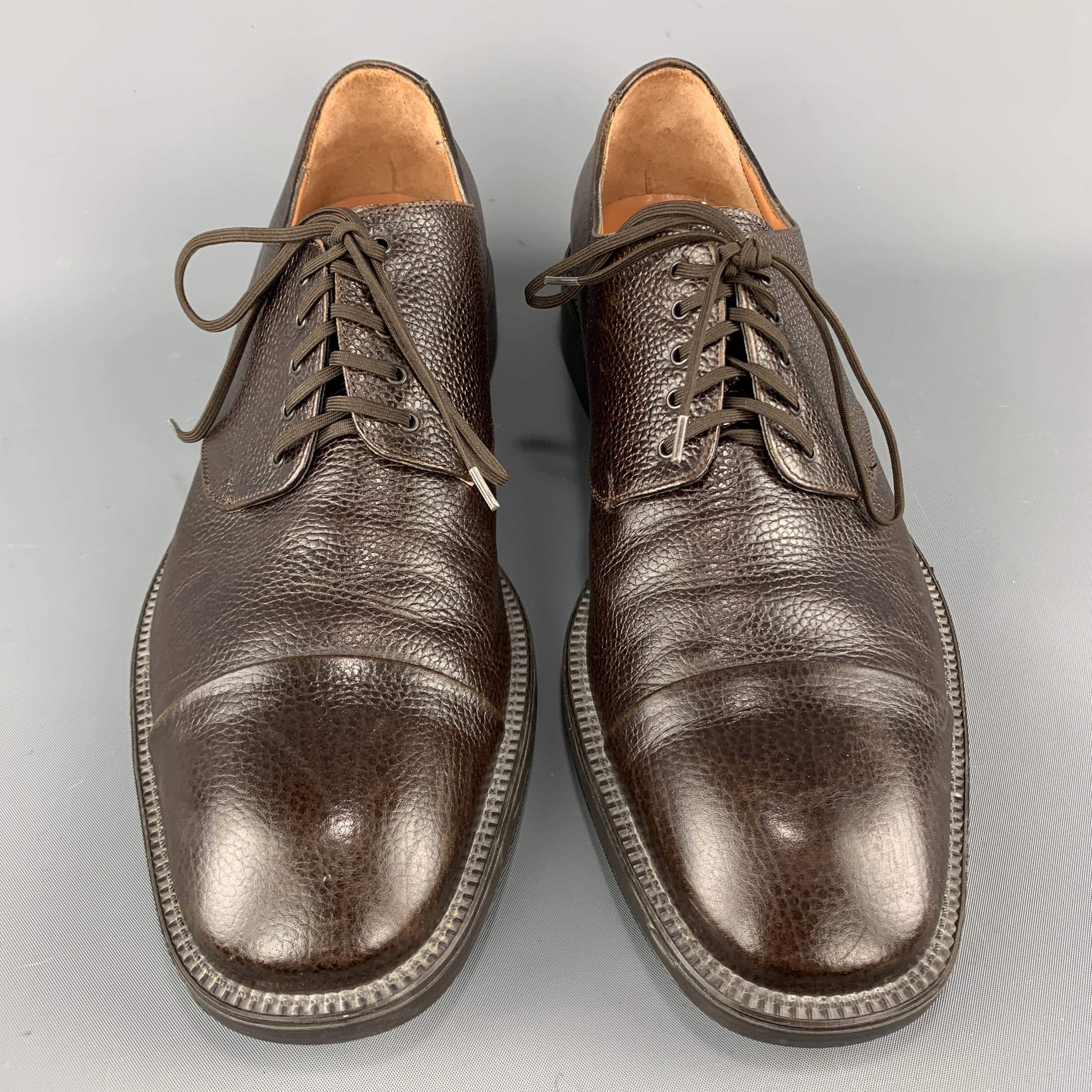 SALVATORE FERRAGAMO dress shoes come in brown textured leather with a toe cap and rubber sole.  Made in Italy.

Excellent Pre-Owned Condition.
Marked: 11

Outsole: 12.5 x 4.5 in.