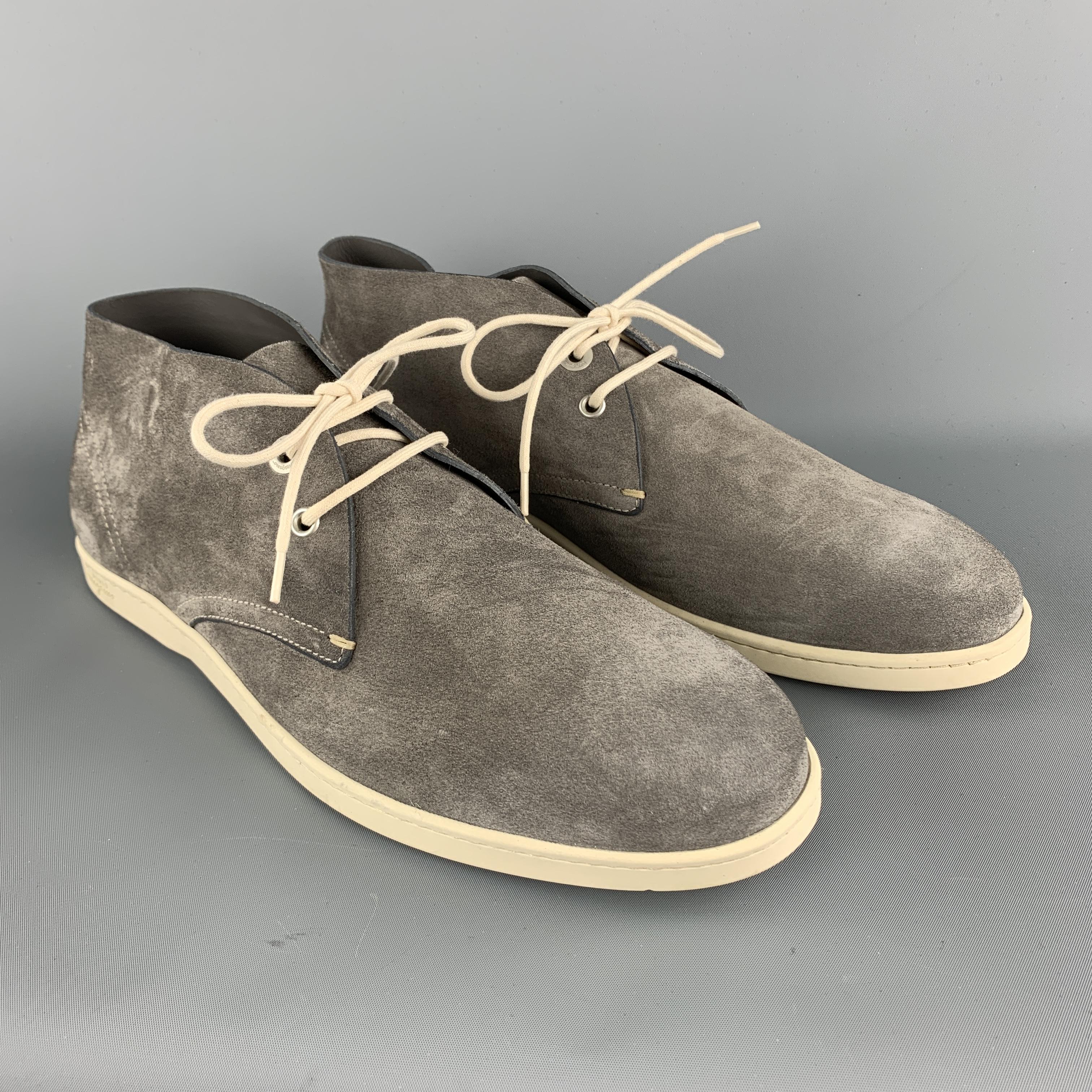 SALVATORE FERRAGAMO Chukka Boots comes in a solid suede material, with a contrast white lace, a branded insole, and a contrast sole. Made in Italy.

Brand New.
Marked: 2018 44 9417

Outsole: 12 x 4 in.
Height: 4 in. 