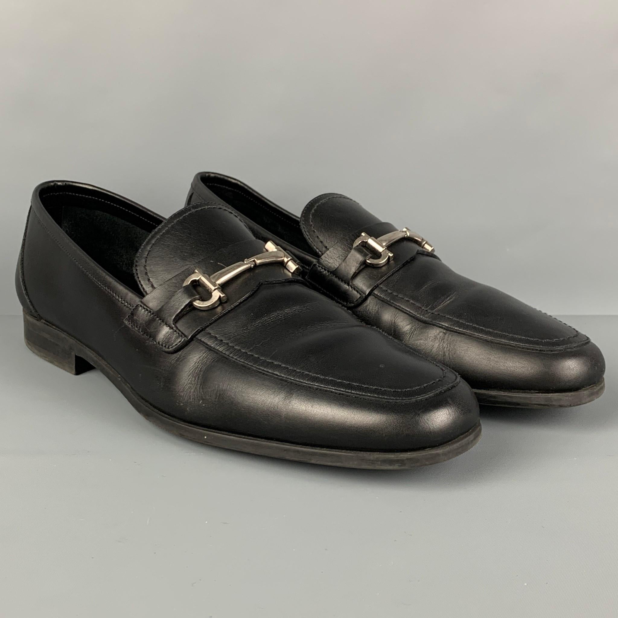 SALVATORE FERRAGAMO loafers comes in a black leather featuring a silver tone horsebit and a slip on style. Made in Italy. 

Very Good Pre-Owned Condition.
Marked: 12 D

Outsole: 12.5 in. x 4 in. 