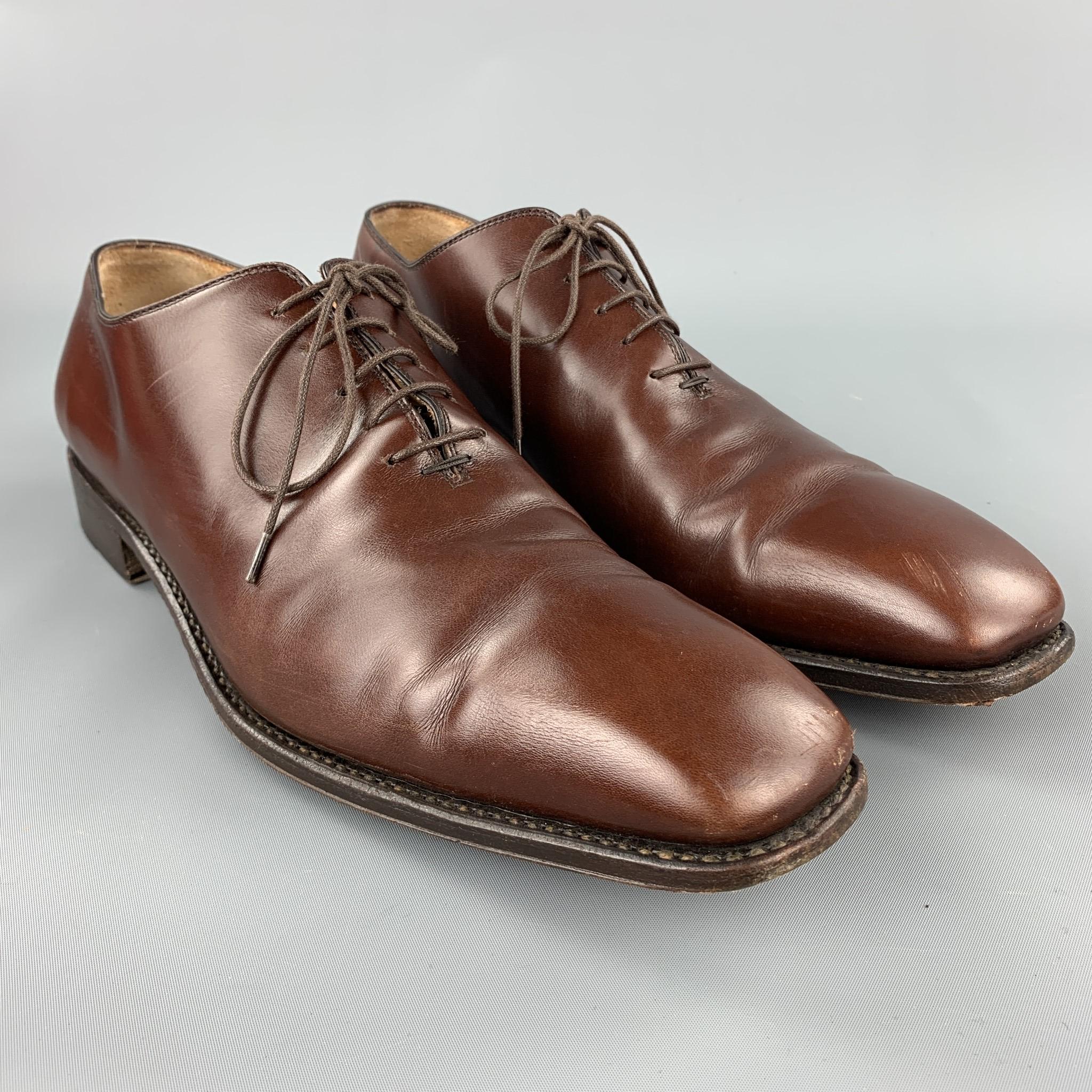 SALVATORE FERRAGAMO lace up shoes comes in a brown leather featuring a plain toe and a wooden sole. As-Is. Comes with box. Made in Italy.

Good Pre-Owned Condition.
Marked: 12 

Outsole:

13 in. x 4 in. 

SKU: 95726
Category: Lace Up Shoes

More