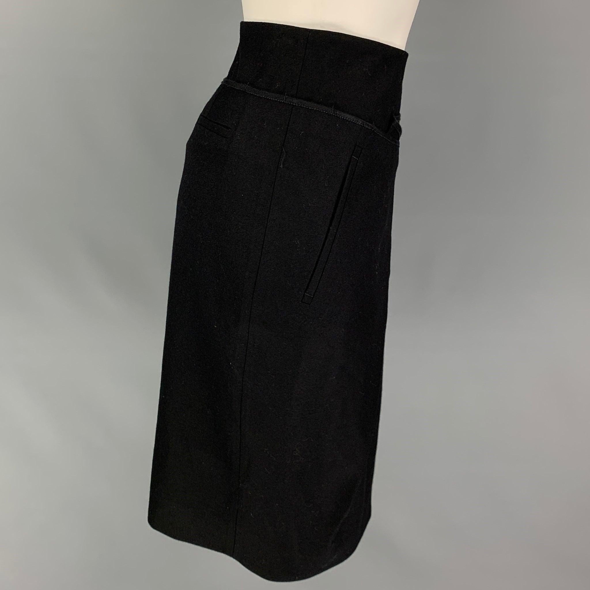 SALVATORE FERRAGAMO skirt comes in a black wool featuring a pleated style, ribbon trim, and a side zipper closure. Made in Italy.
Very Good
Pre-Owned Condition. 

Marked:   38 

Measurements: 
  Waist: 30 inches  Hip: 34 inches  Length: 23 inches 
 