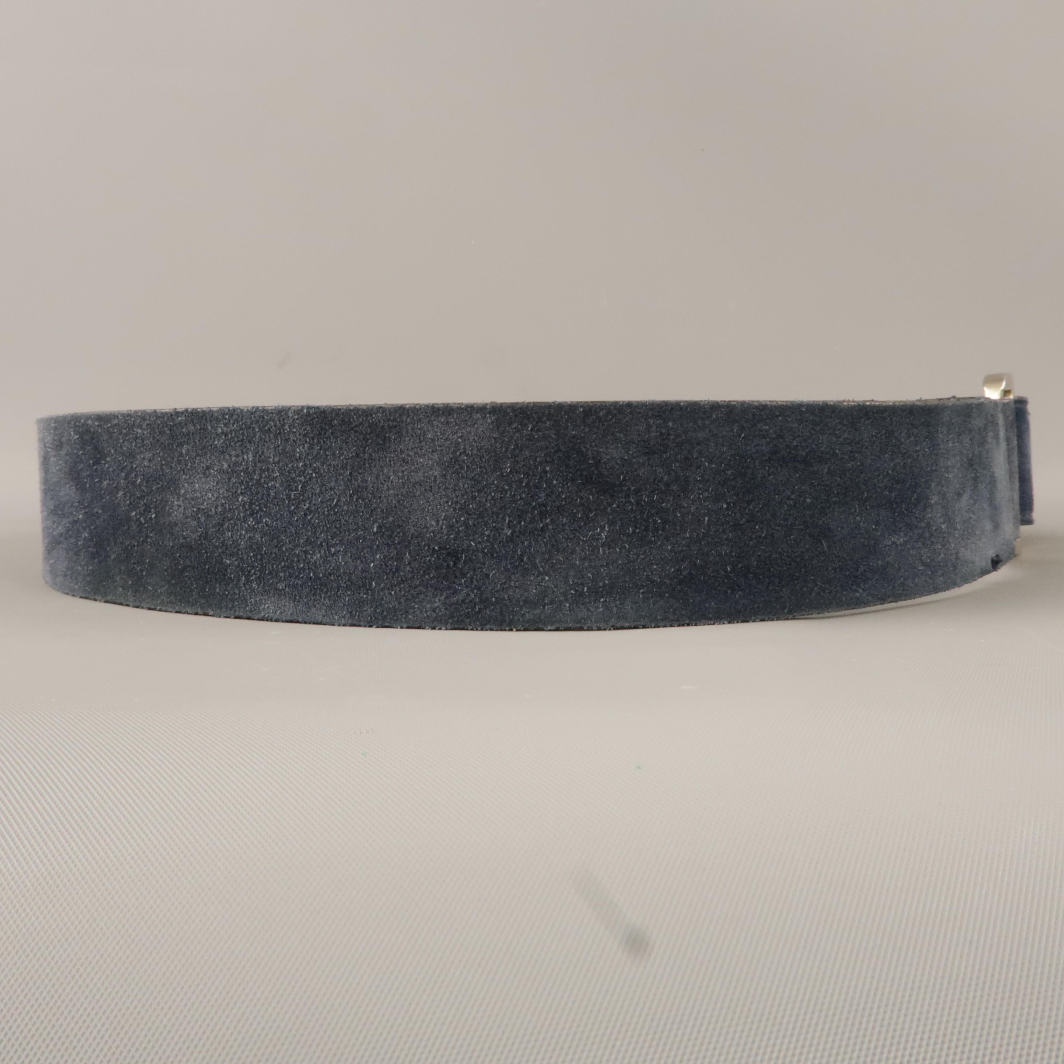 SALVATORE FERRAGAMO belt comes in a navy suede featuring a silver tone buckle. Made in Italy.
 
Very Good Pre-Owned Condition.
Marked: 36
 
Length: 40.5 in.
Width: 1.5 in.
Fits: 36 in.
Buckle: 1.8 in