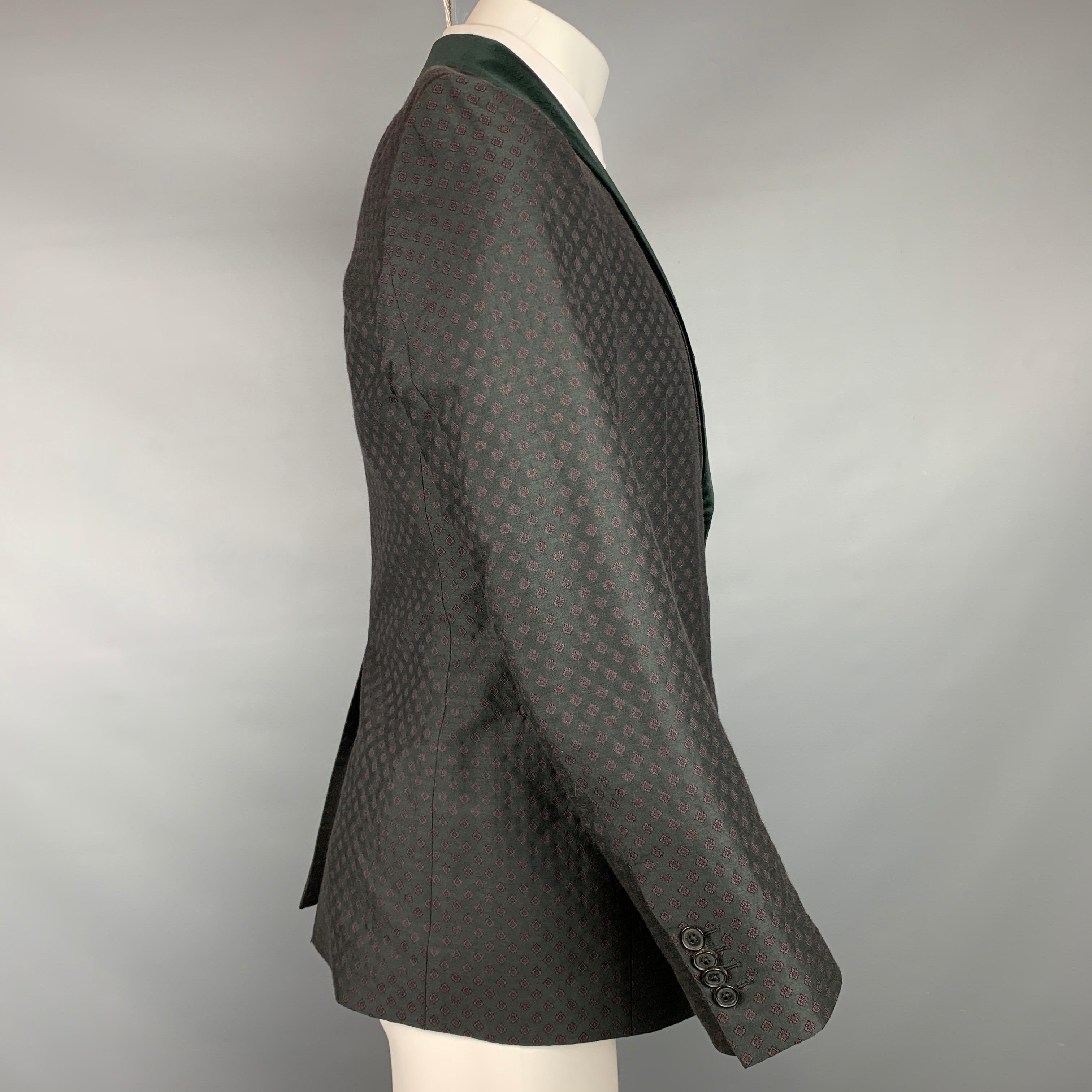 SALVATORE FERRAGAMO sport coat comes in a black & burgundy wool / silk with a full liner featuring a shawl collar, slit pockets, and a double button closure. Made in Italy.

Very Good Pre-Owned Condition.
Marked: 48

Measurements:

Shoulder: 16.5