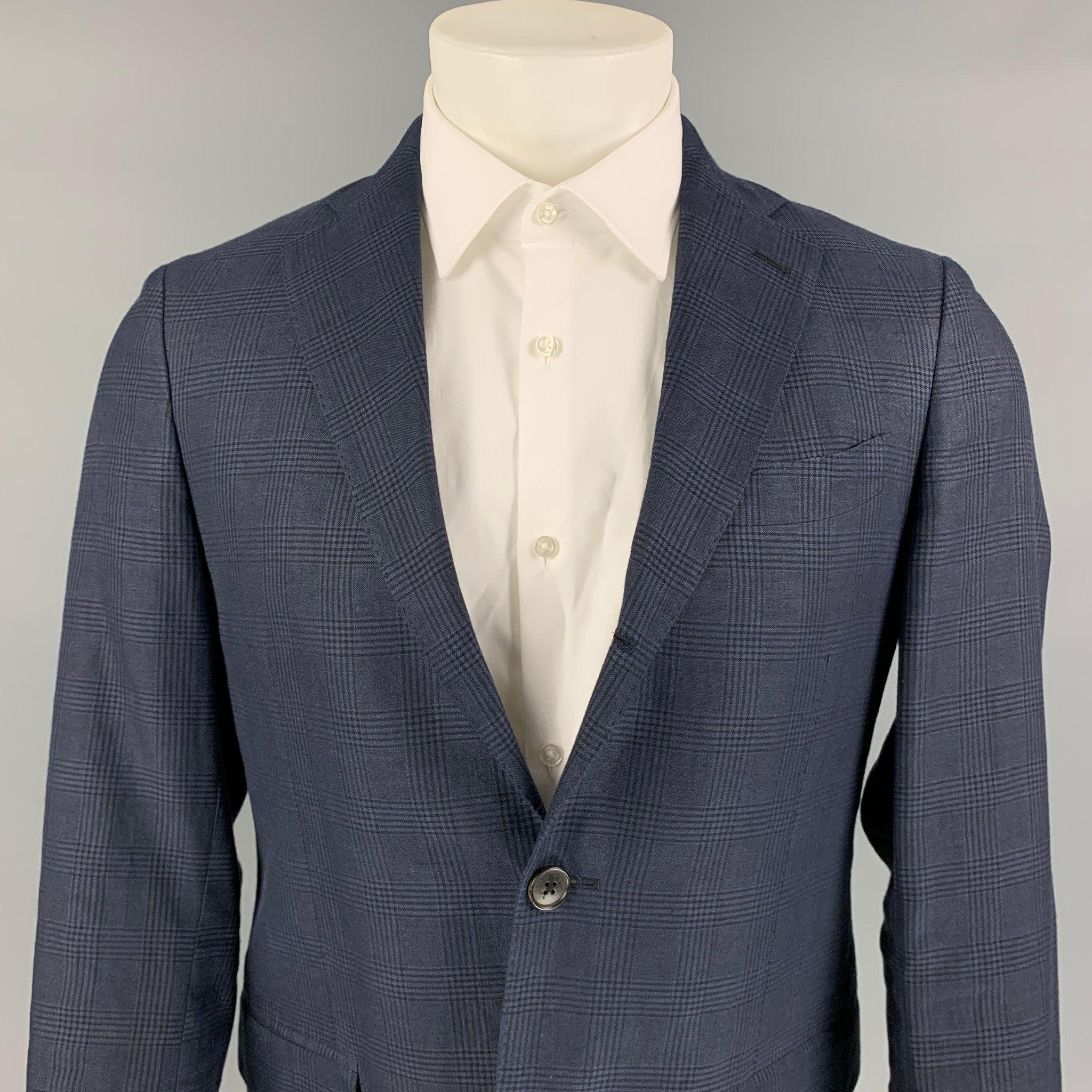 SALVATORE FERRAGAMO sport coat comes in a navy plaid linen blend with a full liner featuring a notch lapel, flap pockets, single back vent, and a three button closure. Made in Italy.
Very Good
Pre-Owned Condition. 

Marked:   48 

Measurements: 
