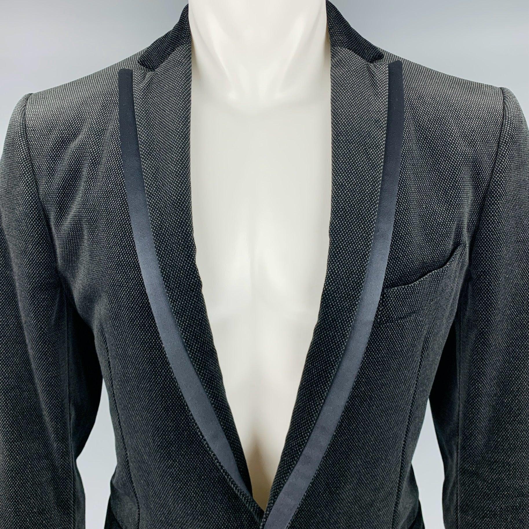 SALVATORE FERRAGAMO sport coat
in a black cotton velvet fabric featuring nailhead pattern, notch lapel, and single button closure. Made in Italy.Excellent Pre-Owned Condition. 

Marked:   50 

Measurements: 
 
Shoulder: 18 inches Chest: 40 inches