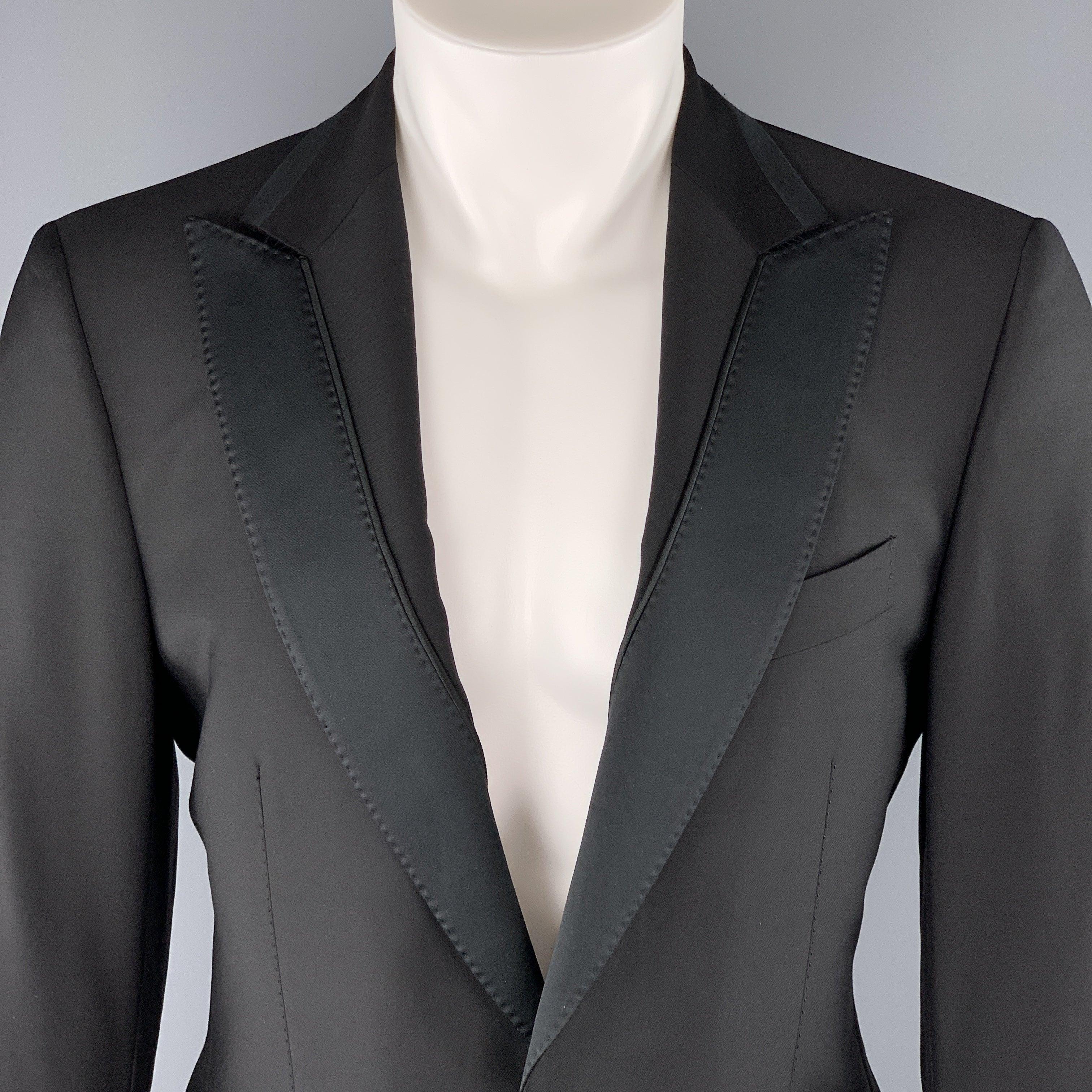 SALVATORE FERRAGAMO
sport coat comes in black wool with a satin detailed peak lapel, single breasted, one button front, and satin piping. Made in Italy.Excellent Pre-Owned Condition. 

Marked:   IT 50 

Measurements: 
 
Shoulder: 17.5 inches
