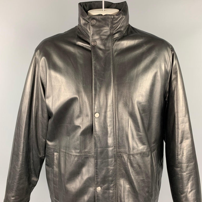 SALVATORE FERRAGAMO coat comes in a black leather featuring a reversible style, high collar, slit pockets, and a zip & snap button closure. Made in Italy.

Very Good Pre-Owned Condition.
Marked: 52

Measurements:

Shoulder: 22 in.
Chest: 50