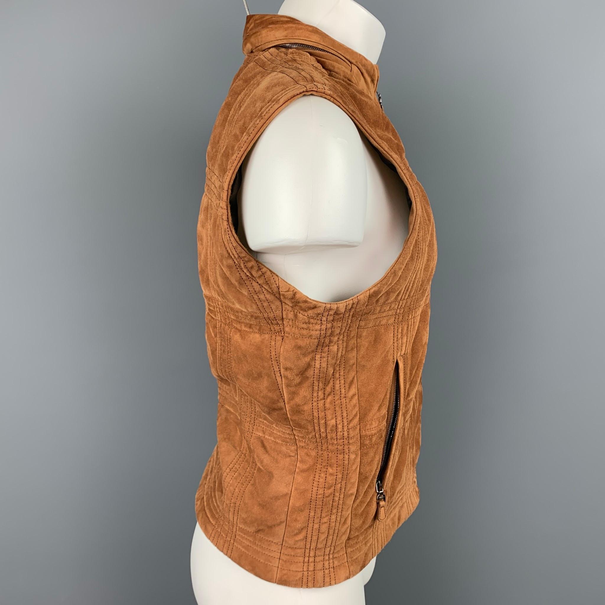 SALVATORE FERRAGAMO vest comes in a tan suede with a monogram print liner featuring a hidden hood design, top stitching, slit pockets, and a full zip closure. Made in Italy.

Very Good Pre-Owned Condition.
Marked: IT 52

Measurements:

Shoulder: