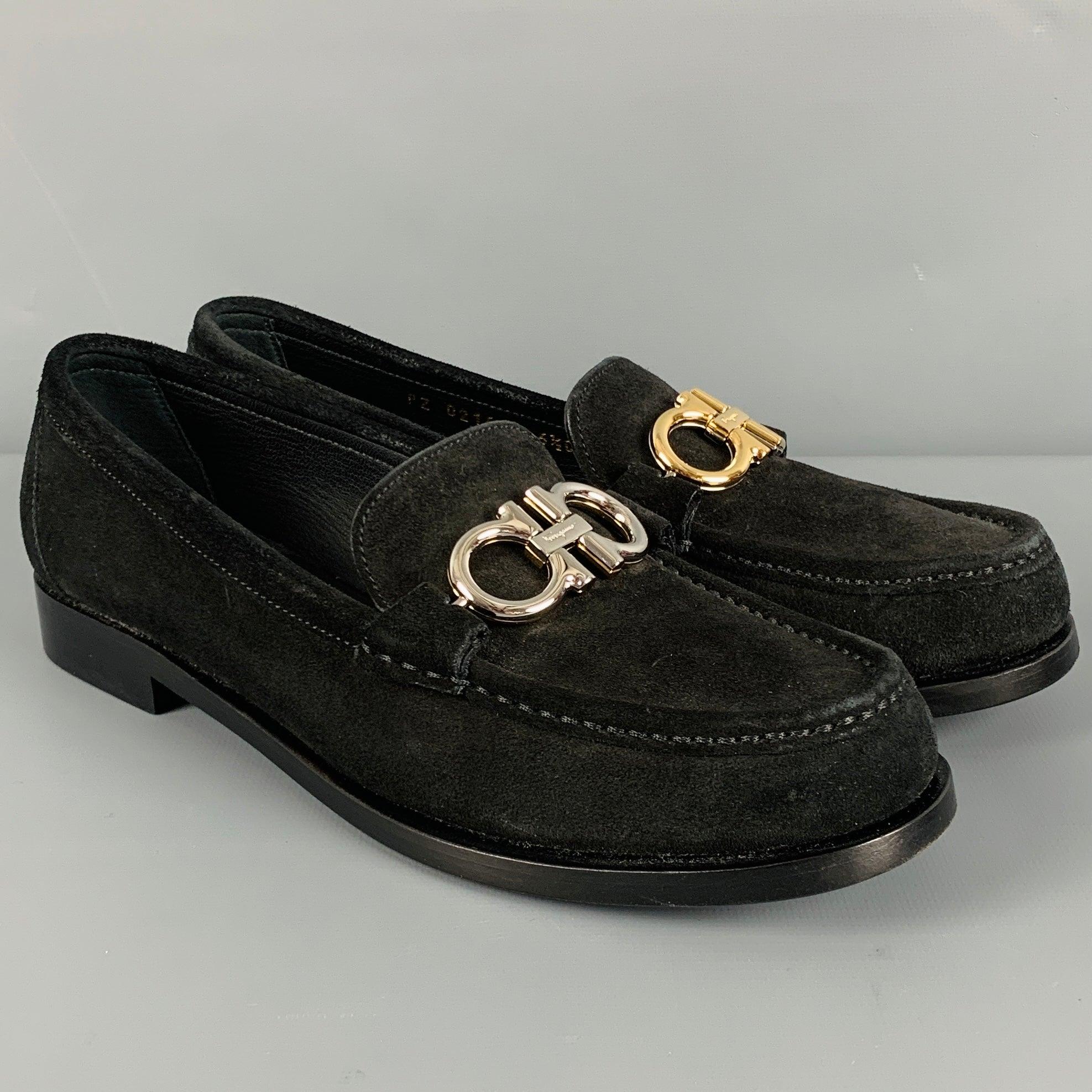 SALVATORE FERRAGAMO flats in a black suede featuring a loafer style, two tone silver and gold tone Ferragamo buckles, and slip on closure. Comes with box. Made in Italy.New with Box. 

Marked:   PZ 02161 6.5COutsole:9.75 x 3.25
inches 
  
  
