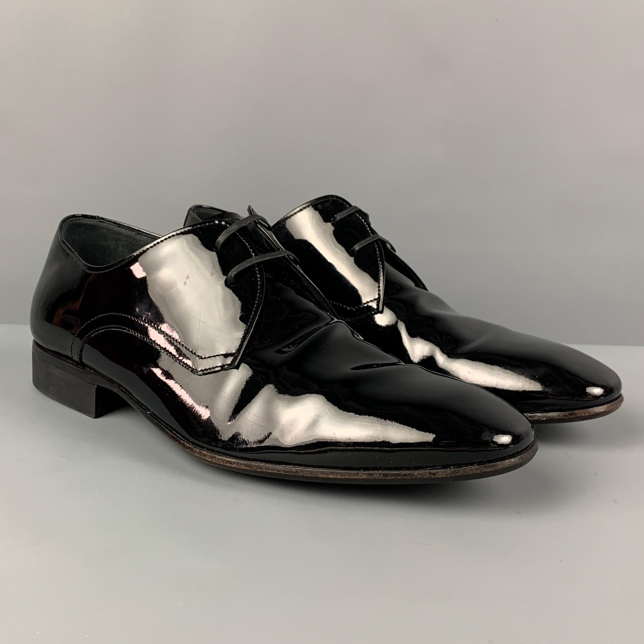 SALVATORE FERRAGAMO shoes comes in a black patent leather featuring a classic style and a lace up closure. Made in Italy. 

Very Good Pre-Owned Condition.
Marked: 8  EE

Outsole: 11.5 in. x 3.75 in. 