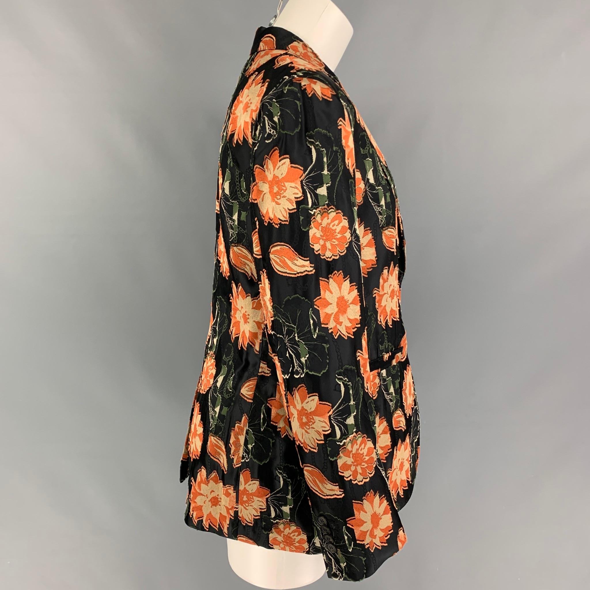 SALVATORE FERRAGAMO blazer comes in a black & orange jacquard floral polyester / viscose featuring a notch lapel, slit pockets, single back vent, and a double button closure. Made in Italy. 

Very Good Pre-Owned Condition.
Marked:
