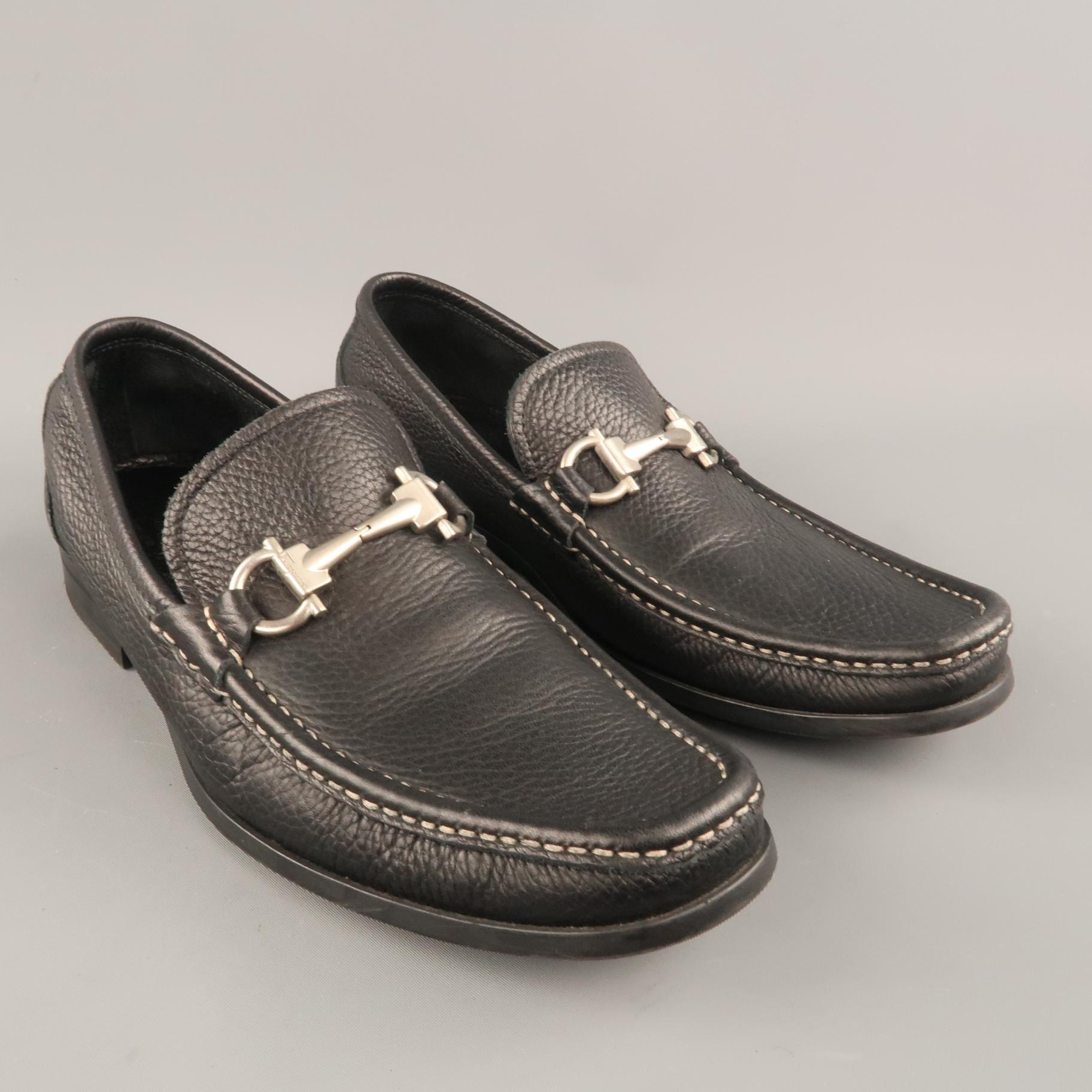 SALVATORE FERRAGAMO loafers come in textured leather with a contrast stitch apron toe detailed with silver tone Gancini hardware. Made in Italy.
 
Excellent Pre-Owned Condition.
Marked: UK 7
 
Outsole: 11.25 x 4 in.