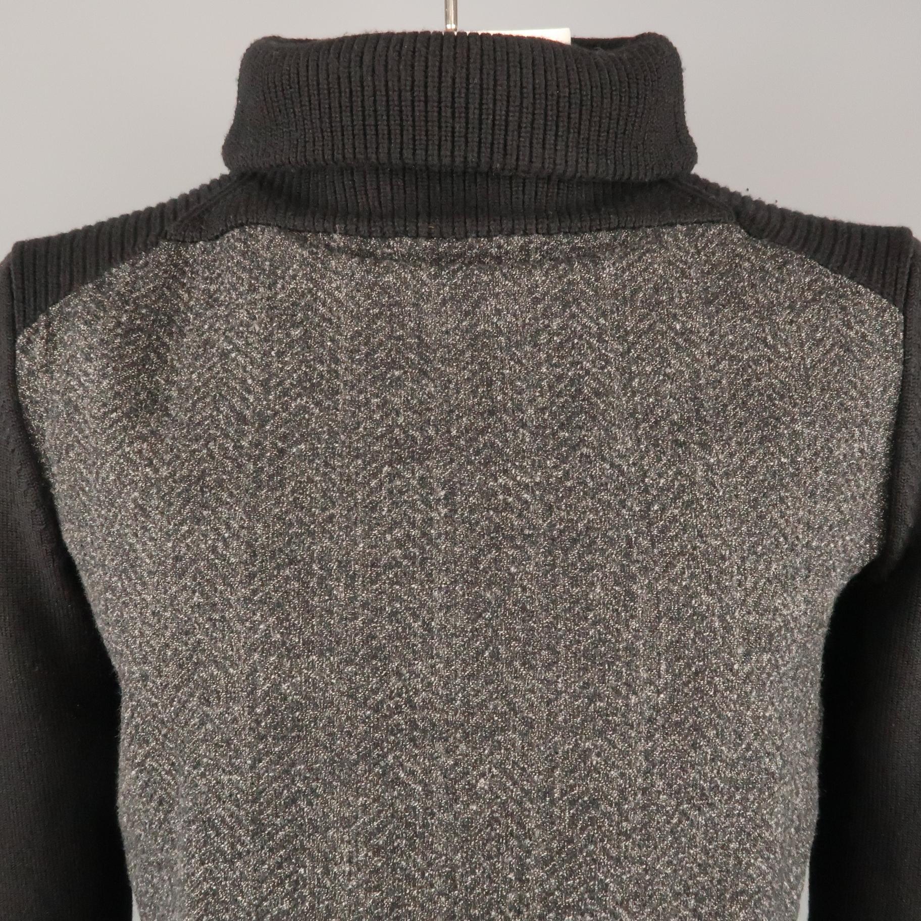 SALVATORE FERRAGAMO turtleneck sweater comes in a black and grey knitted wool featuring a two toned style and long sleeves. Made in Italy.
 
Excellent Pre-Owned Condition.
Marked: L
 
Measurements:
 
Shoulder: 19 in.
Chest: 42 in.
Sleeve: 25 5