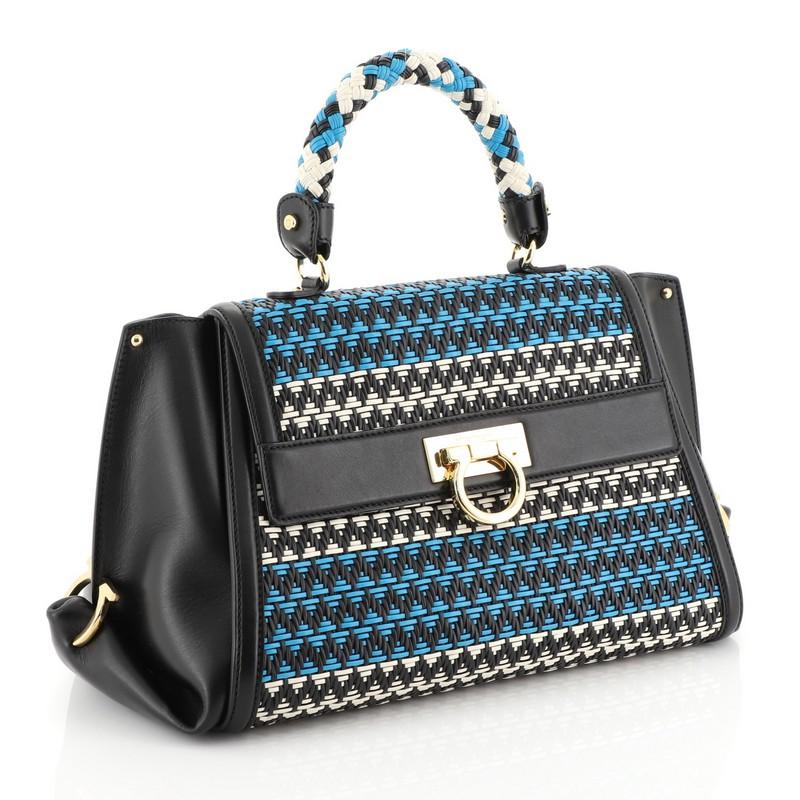 This Salvatore Ferragamo Sofia Satchel Multicolor Woven Leather Medium, crafted in blue, black and multicolor woven leather, features a woven leather top handle, protective base studs, and gold-tone hardware. Its flip-lock Gancio closure opens to a