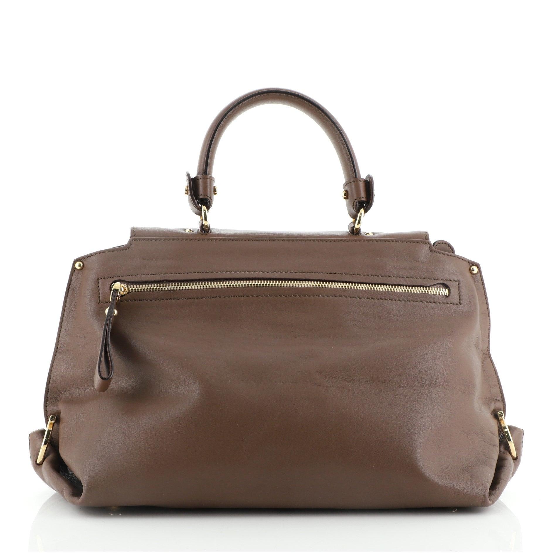 Salvatore Ferragamo Sofia Satchel Smooth Leather Medium
Brown Smooth Leather

Condition Details: Loss of shape, light scuffs and wear on exterior, minor scuffs on strap, creasing on strap. Splitting on handle base wax edges, cracking on flap and