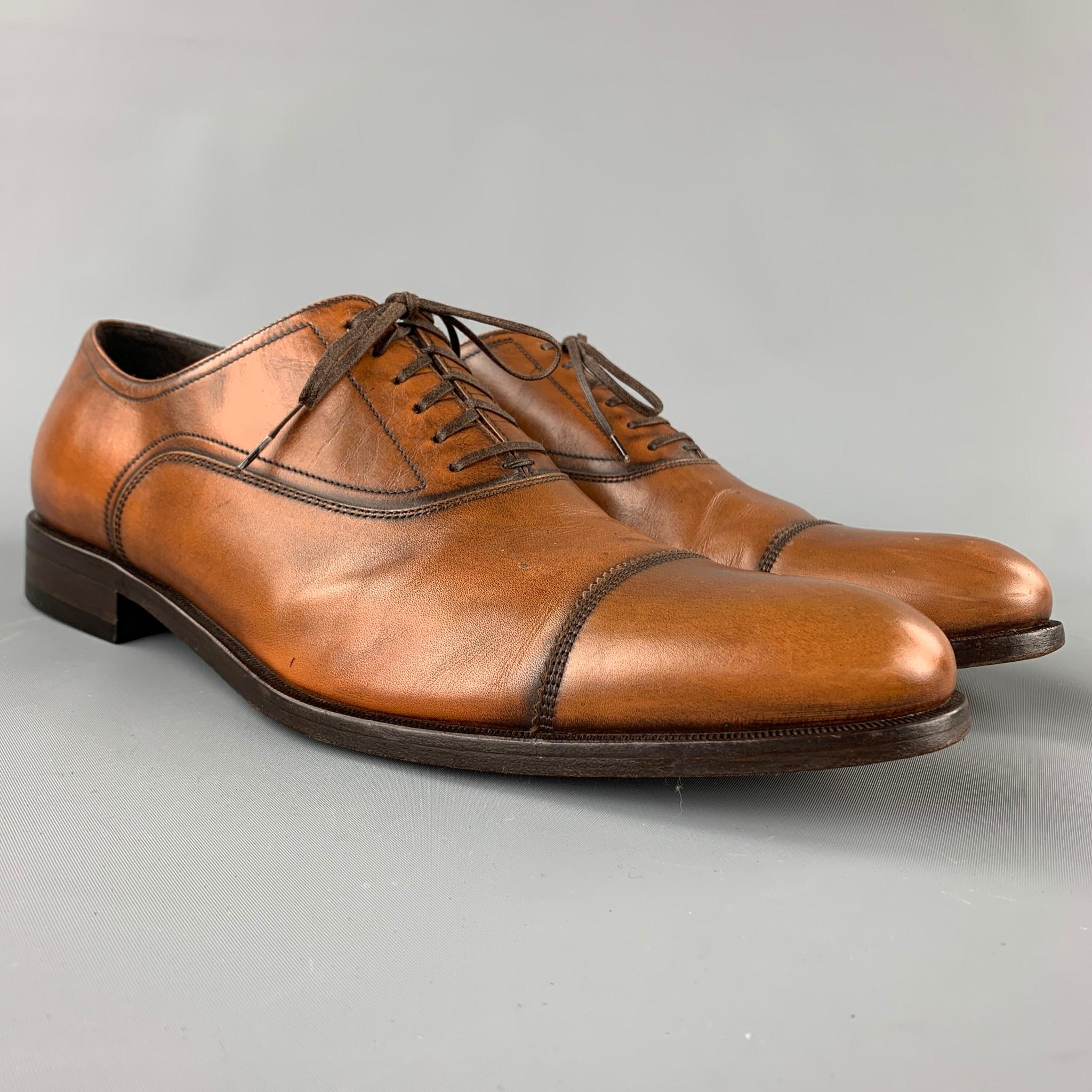 SALVATORE FERRAGAMO shoes comes in a tan antique leather featuring a cap toe, wooden sole, and a lace up closure. Made in Italy.

Good Pre-Owned Condition.
Marked: 12 D

Measurements:

13 in. x 4 in.
 