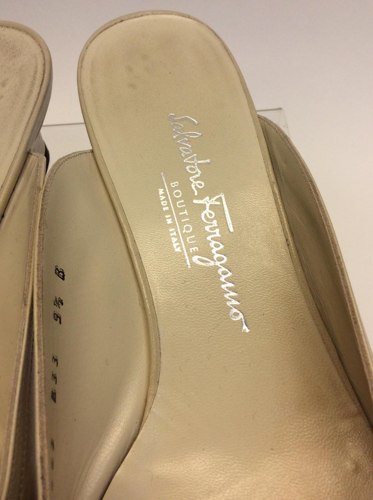 black and gold ferragamo slides
