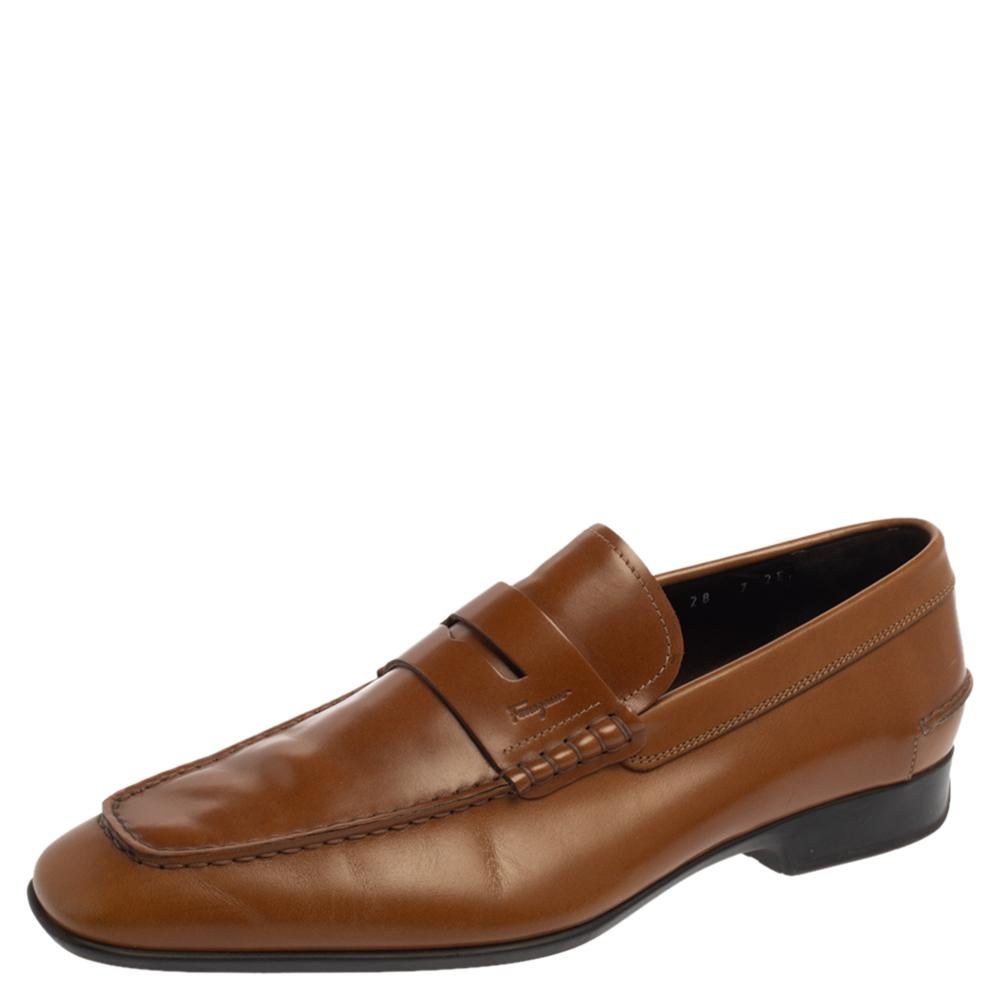 Made from tan-hued leather, these loafers from Salvatore Ferragamo are smart and comfortable. They feature penny keeper straps on the vamps, snug, labeled insoles, and rubber outsoles. Flaunt them with both your casual and formal looks.

Includes: