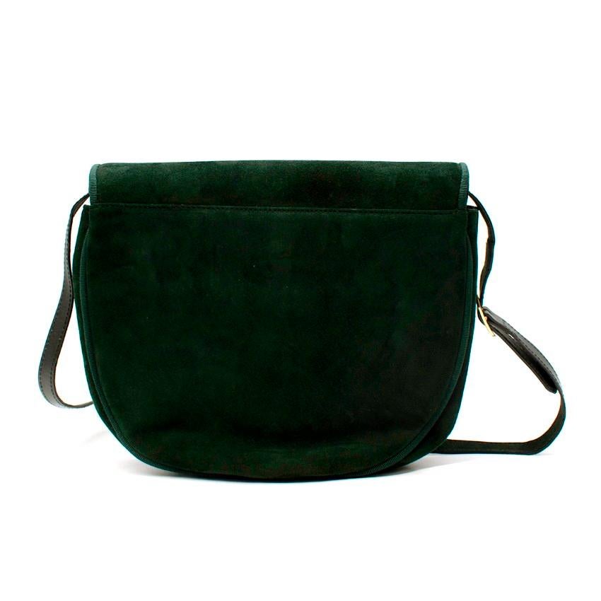 Salvatore Ferragamo Vara Bow Bottle Green Suede Cross Body Bag

- Deep bottle green suede cross body bag with tonal grosgrain edging 
- Iconic vara bow on front flap
- Magnetic flap closure
- Adjustable leather strap
- One compartment with zip-up