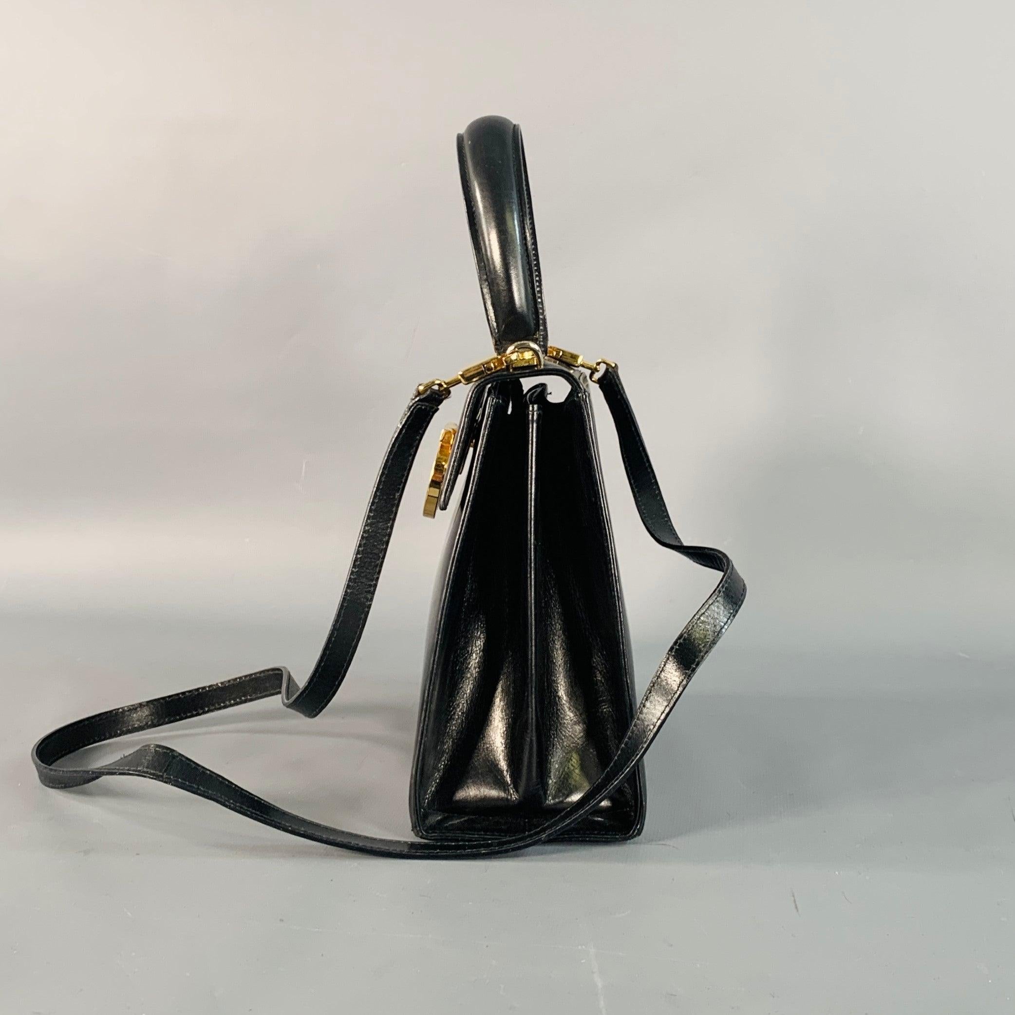 SALVATORE FERRAGAMO Vintage Schwarz Gold Leder Griffe Handtasche im Angebot 1