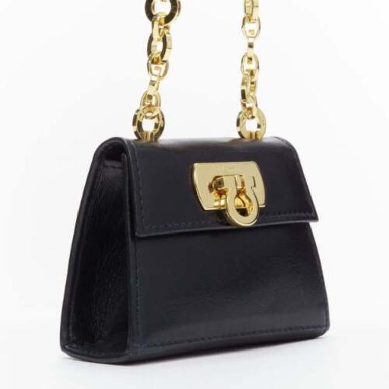 Black SALVATORE FERRAGAMO Vintage Gancini black gold chain mini waist belt bag For Sale