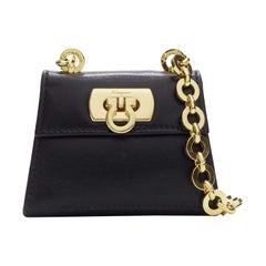 SALVATORE FERRAGAMO Vintage Gancini black gold chain mini waist belt bag