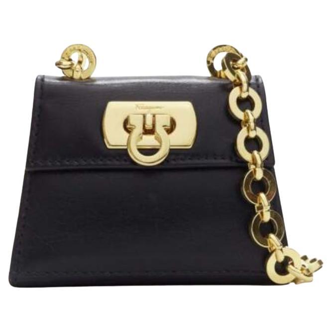 SALVATORE FERRAGAMO Vintage Gancini black gold chain mini waist belt bag For Sale