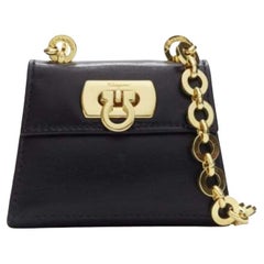 SALVATORE FERRAGAMO Vintage Gancini black gold chain mini waist belt bag